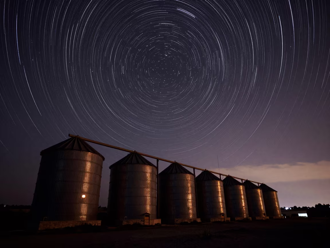 Star Trails Over Greek Grain Silos Night Sky in beneath a moon-washed horizon in Greece