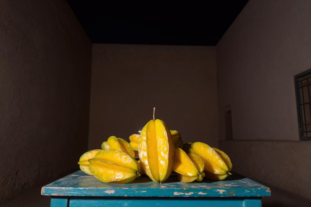 Starfruit Tree on Night Market Table in on a painted produce display table in Ksar el-Kebir
