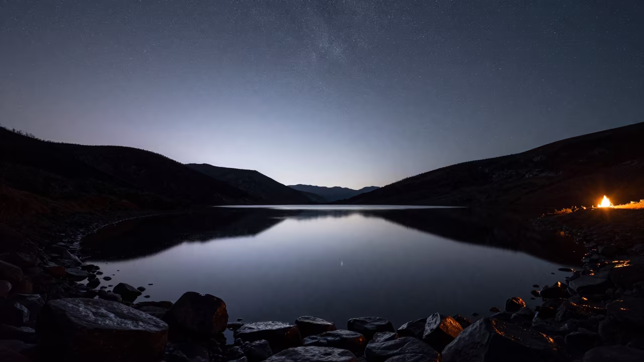 Starry Midnight Sky Over Glassy Alpine Tarn in from a quiet alpine saddle near Tbilisi