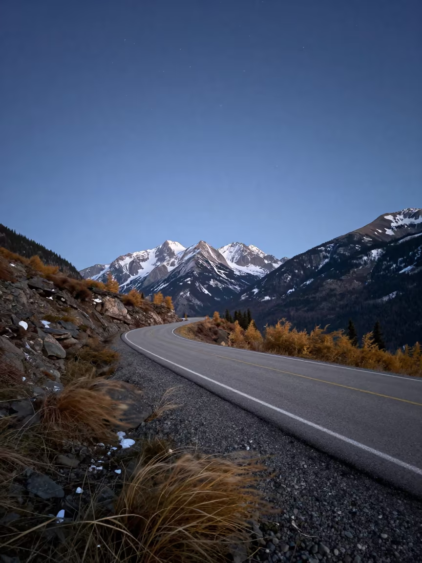 Starry Night Sky Over Winding Alberta Mountain Road in in Alberta