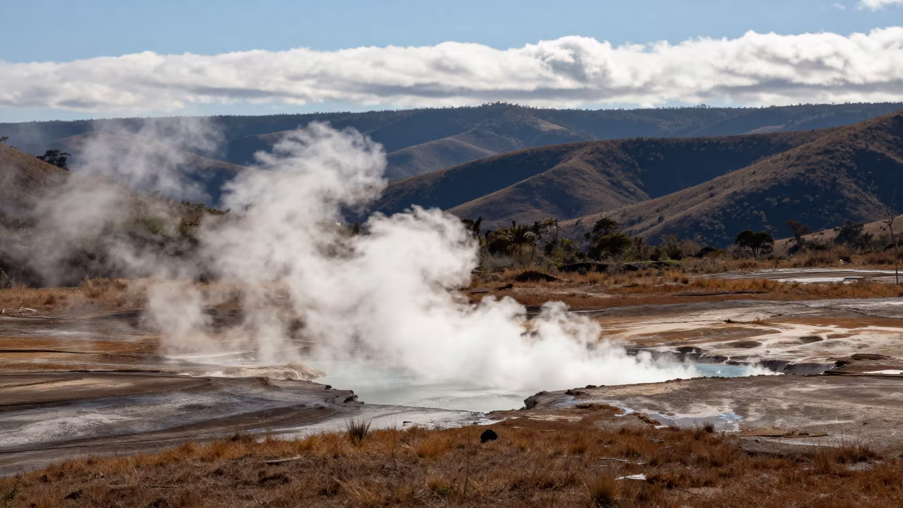 Steam Devil Rising from Lake in Brazil Mountains in from a ridge above layered foothills in Brazil