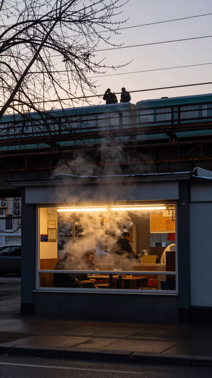 Steaming Pho Window Under Train Tracks Debrecen in under an elevated train line in Debrecen