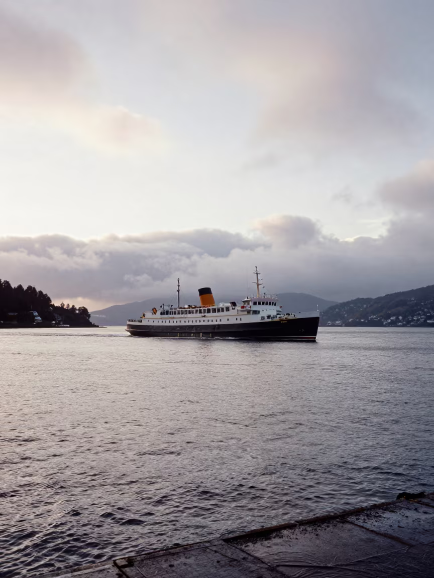 Steamship Listing in New Zealand Harbor Dawn in across a remote ferry crossing in New Zealand