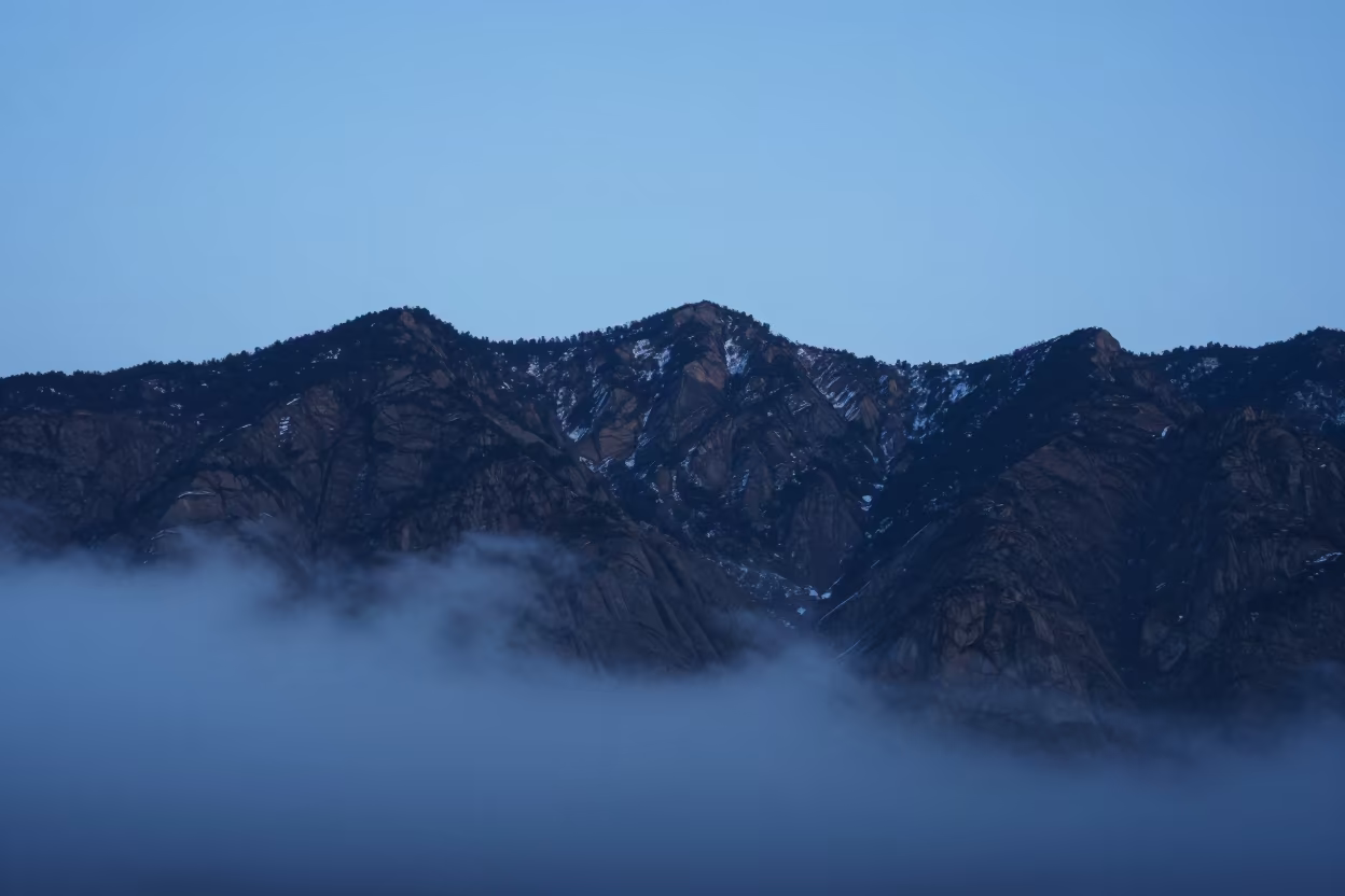 Steel Blue Ridge Above Clouds Uttarakhand in across a wide valley floor in Uttarakhand