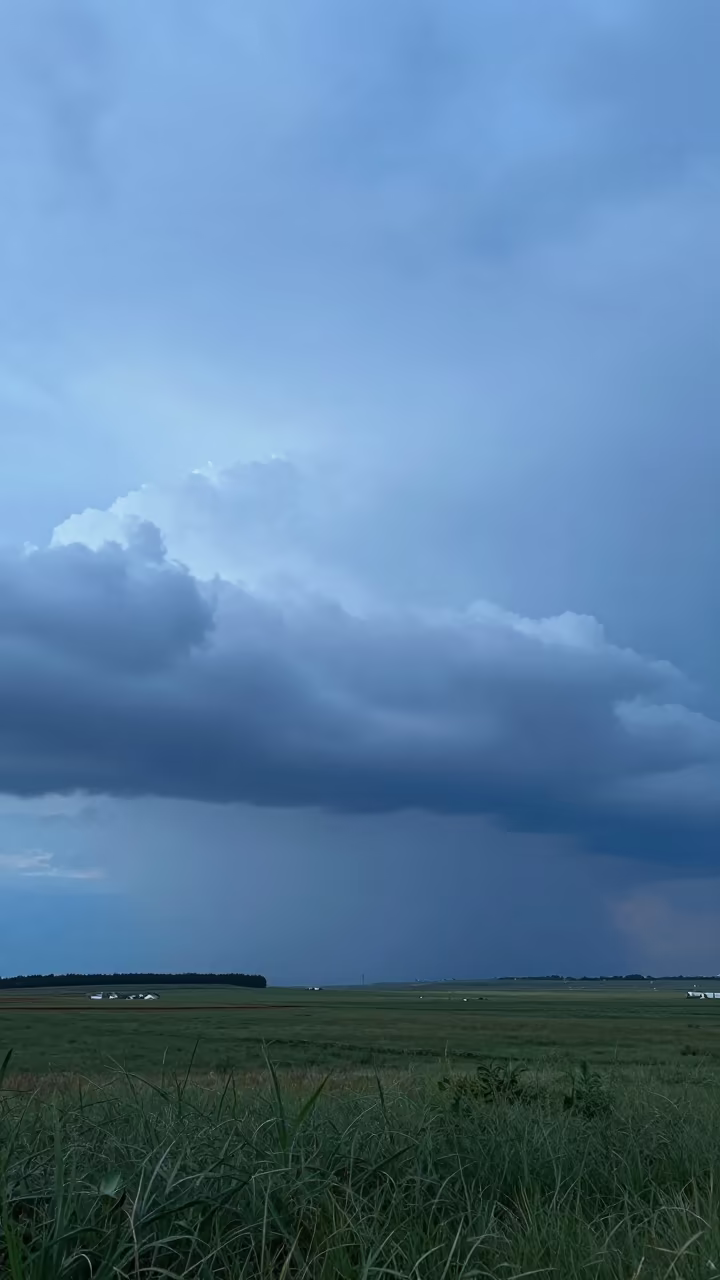 Steel Blue Shelf Cloud Over Xian Prairie in across a storm-bright plain near Xian