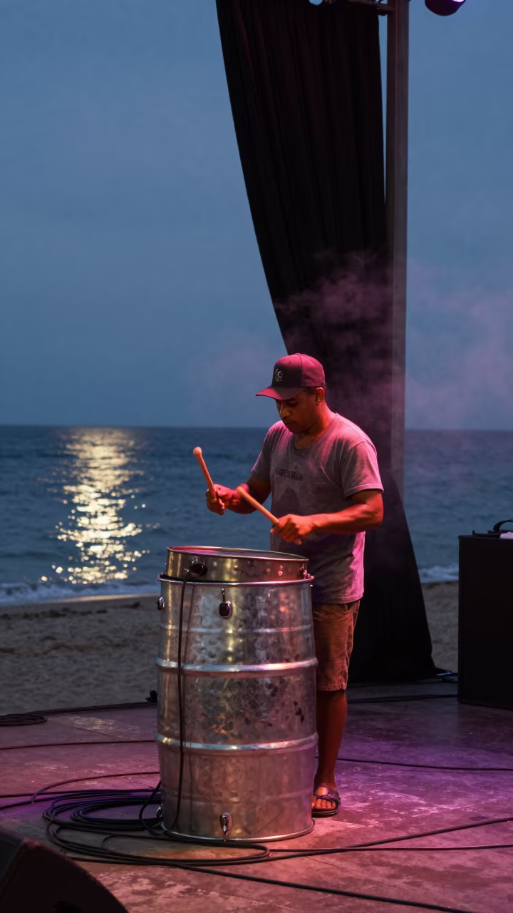Steel Drum Performer on Havana Beach at Dusk in on a dimly lit stage in Havana