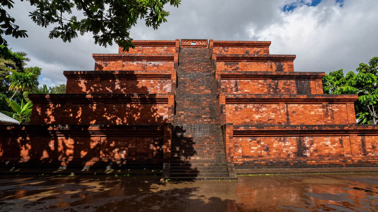 Stepped Ziggurat Facade in Rainy Season Light in in a lantern-lined temple precinct in Papua New Guinea