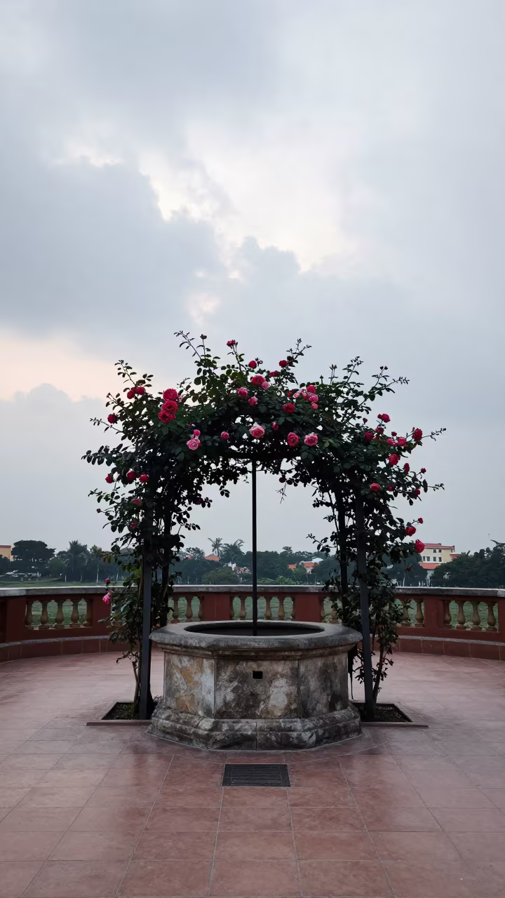 Stone well and roses in Cholon stair hall in inside a tiled stair hall in Cholon, Ho Chi Minh City