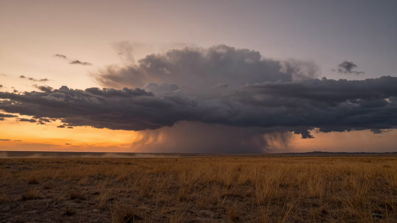 Storm Clouds Over Gansu Prairie at Sunset in beneath fast-moving cloud bands in Gansu