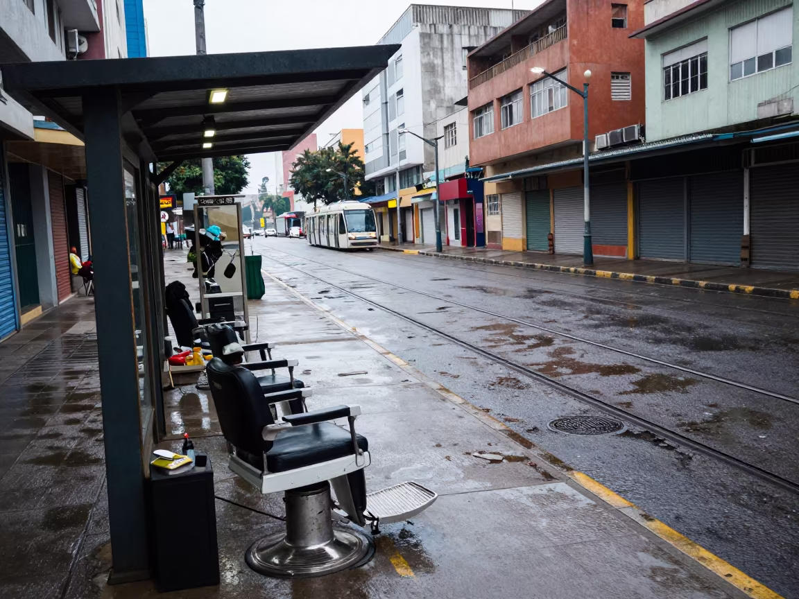 Street Barber Setup Near Tram Stop in Douala in along a shuttered arcade in Douala