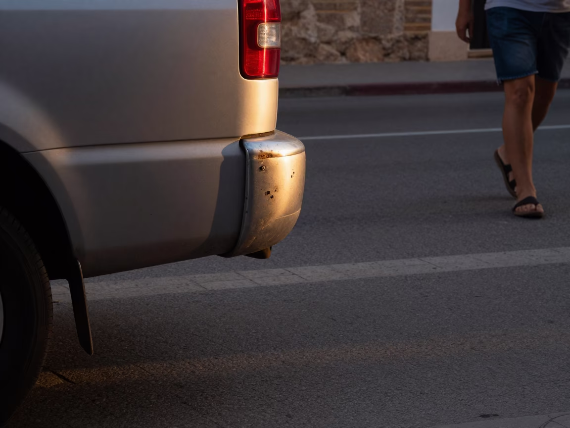 Summer Evening Street Scene in Valencia With Dented Metal Rim in in Valencia, Spain