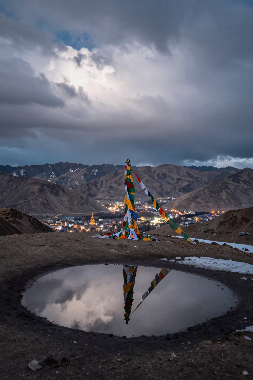 Summit Cairn and Prayer Flags at Dawn in beside a summit cairn above the tree line near Leh
