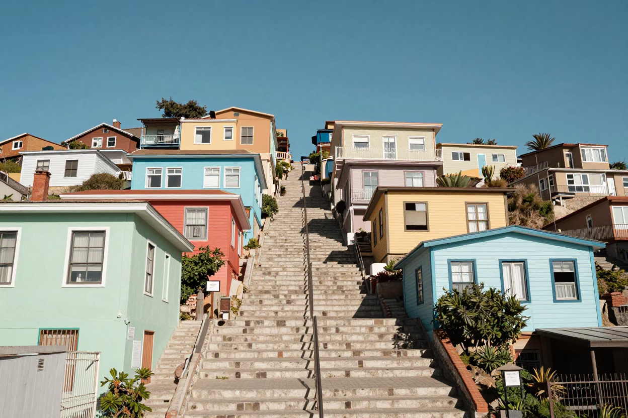 Sun-Bleached Colorful Houses on Steep Valparaiso Steps Under Harsh Noon Light in in Valparaiso, Chile