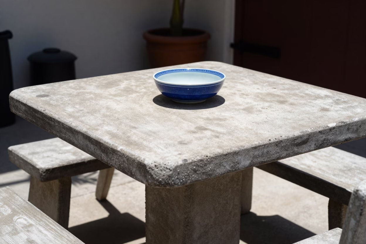 Sun-bleached San Diego Patio with Vintage Blue Porcelain Bowl and Grease Sheen in in San Diego, California, United States