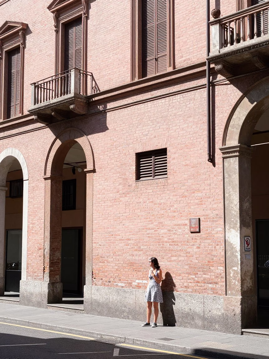 Sun-drenched Bologna street scene with historic architecture and daily life under noon glare in in Bologna, Italy