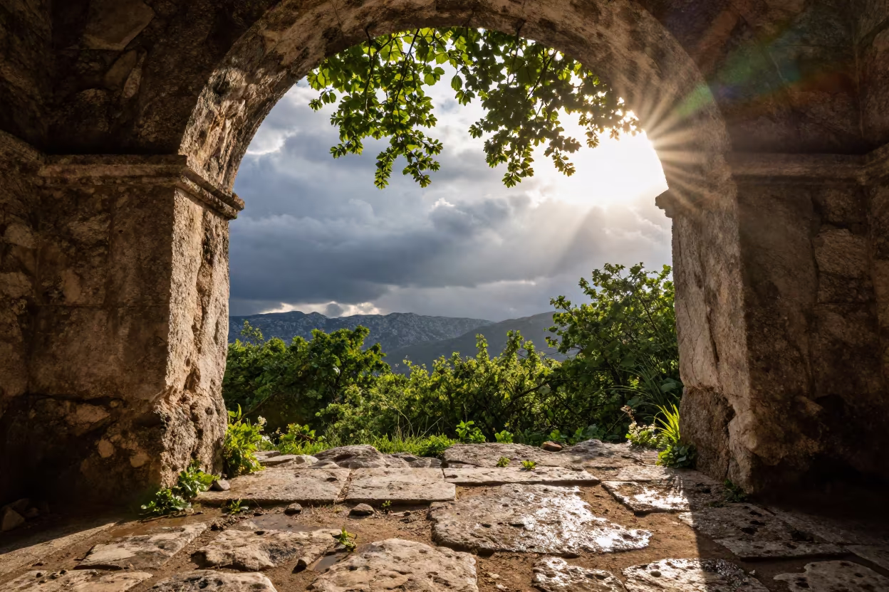 Sun Flare Through Arch Over Montenegro Storms in over a horizon of stacked thunderheads in Montenegro