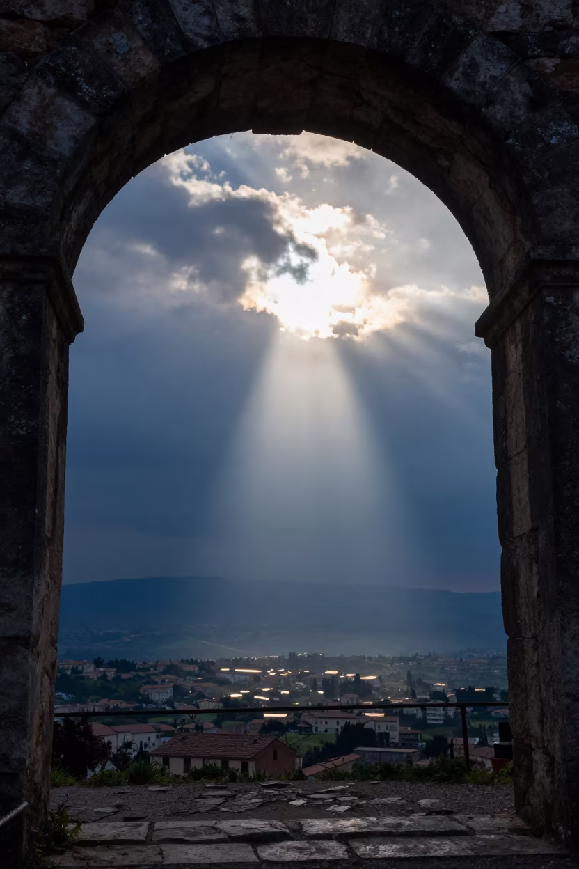 Sun Flare Through Arch Over Storm Clouds in over a horizon of stacked thunderheads in Campania