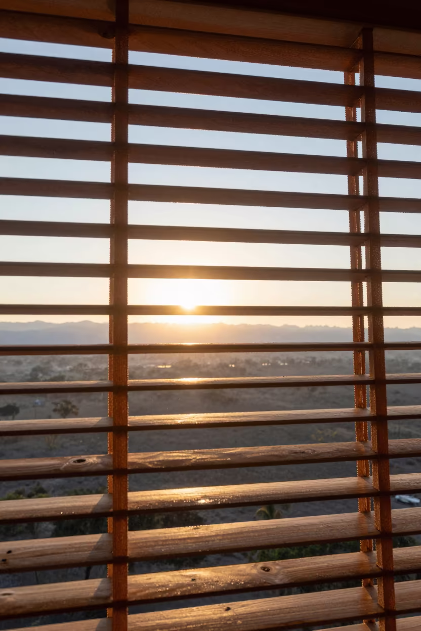 Sun Flare Through Blinds Over Stormy Plain in across a storm-bright plain near Lubango