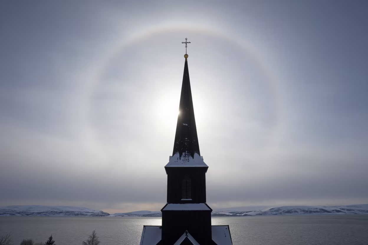 Sun Halo Over Snow Church Kiruna Storm in over a horizon of stacked thunderheads near Kiruna