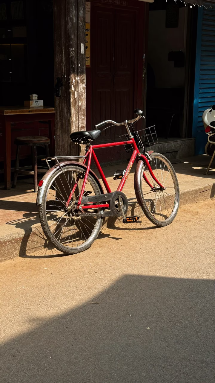 Sunlight and shadows on a bicycle parked beside a traditional cafe in Kathmandu Nepal in in Kathmandu, Nepal