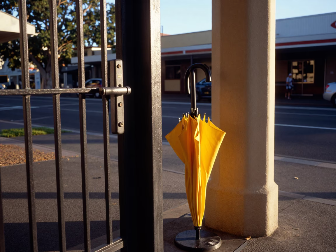 Sunlit Adelaide Street Scene with Gate Handle and Umbrella Stand in in Adelaide, South Australia, Australia