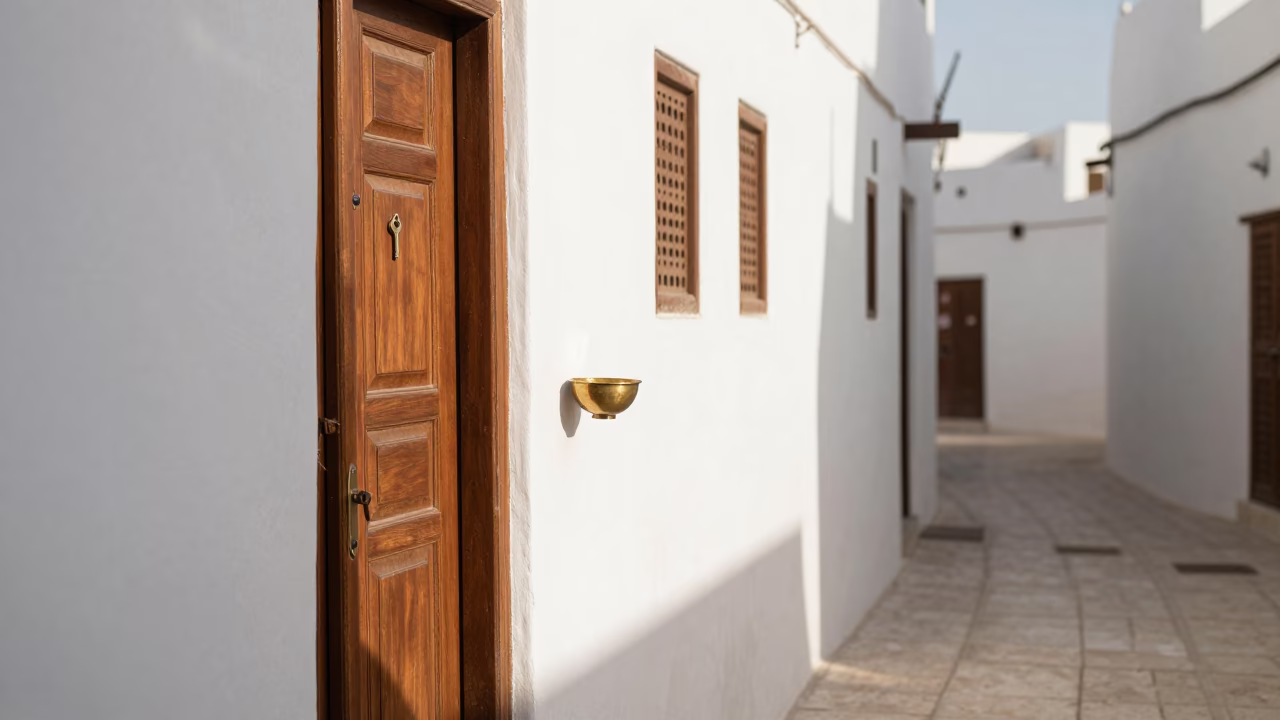 Sunlit Alleyway Scene in Muscat Oman With Key Bowl and Postcards in in Muscat, Oman