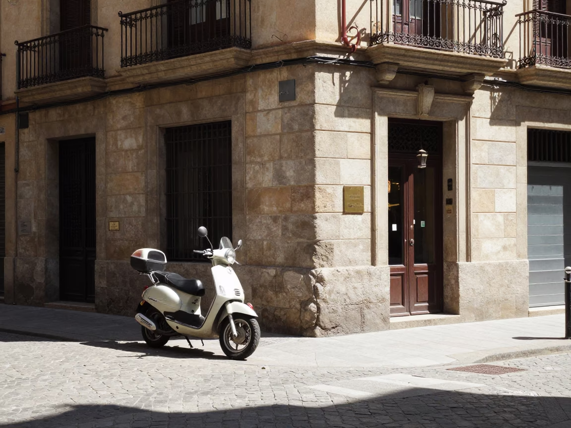 Sunlit Barcelona Street Corner with Vintage Motorcycle and Local Pedestrians at Midday in in Barcelona, Spain