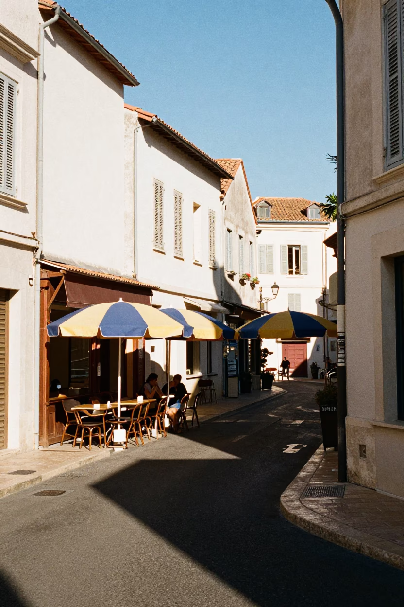 Sunlit Marseille Street Scene with Umbrellas and Daily Life in Early Afternoon in in Marseille, France