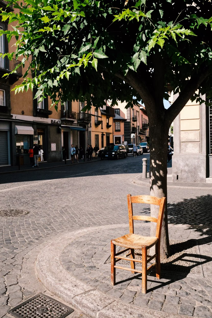 Sunlit Naples Street Corner with Tree and Worn Chair in in Naples, Italy