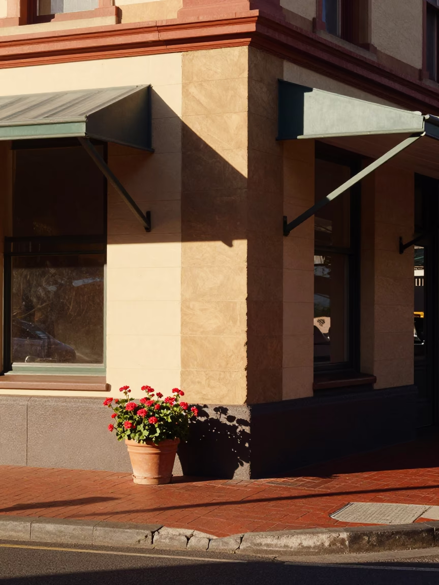 Sunlit Perth Street Corner with Potted Geraniums and Vintage Bicycle in in Perth, Western Australia, Australia