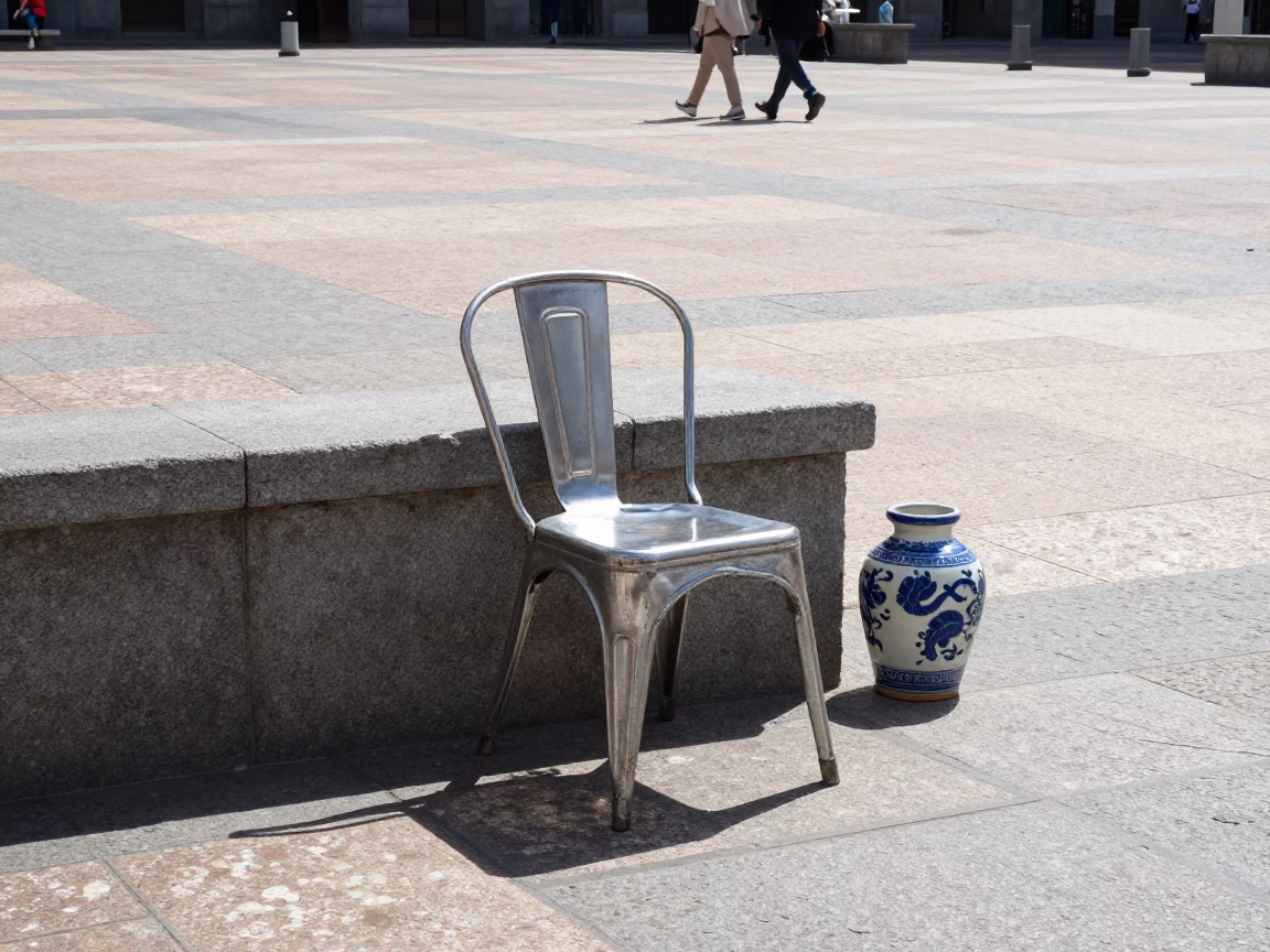 Sunlit Plaza Scene in Madrid Spain with Vintage Chair and Ceramic Vessel in in Madrid, Spain