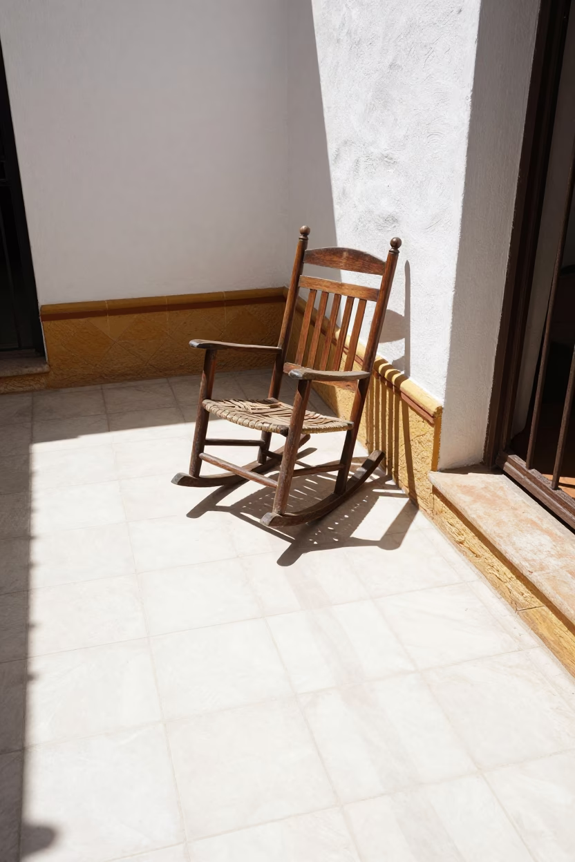 Sunlit Seville Patio with Traditional Tiles and Household Items in in Seville, Spain