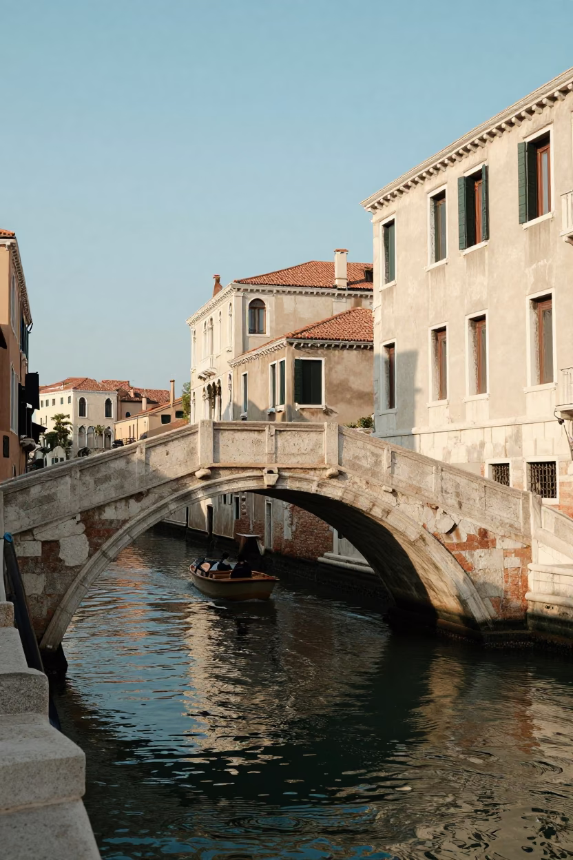 Sunlit Venice Canal Bridge Late Morning Stone Arch and Water Reflection in in Venice, Italy