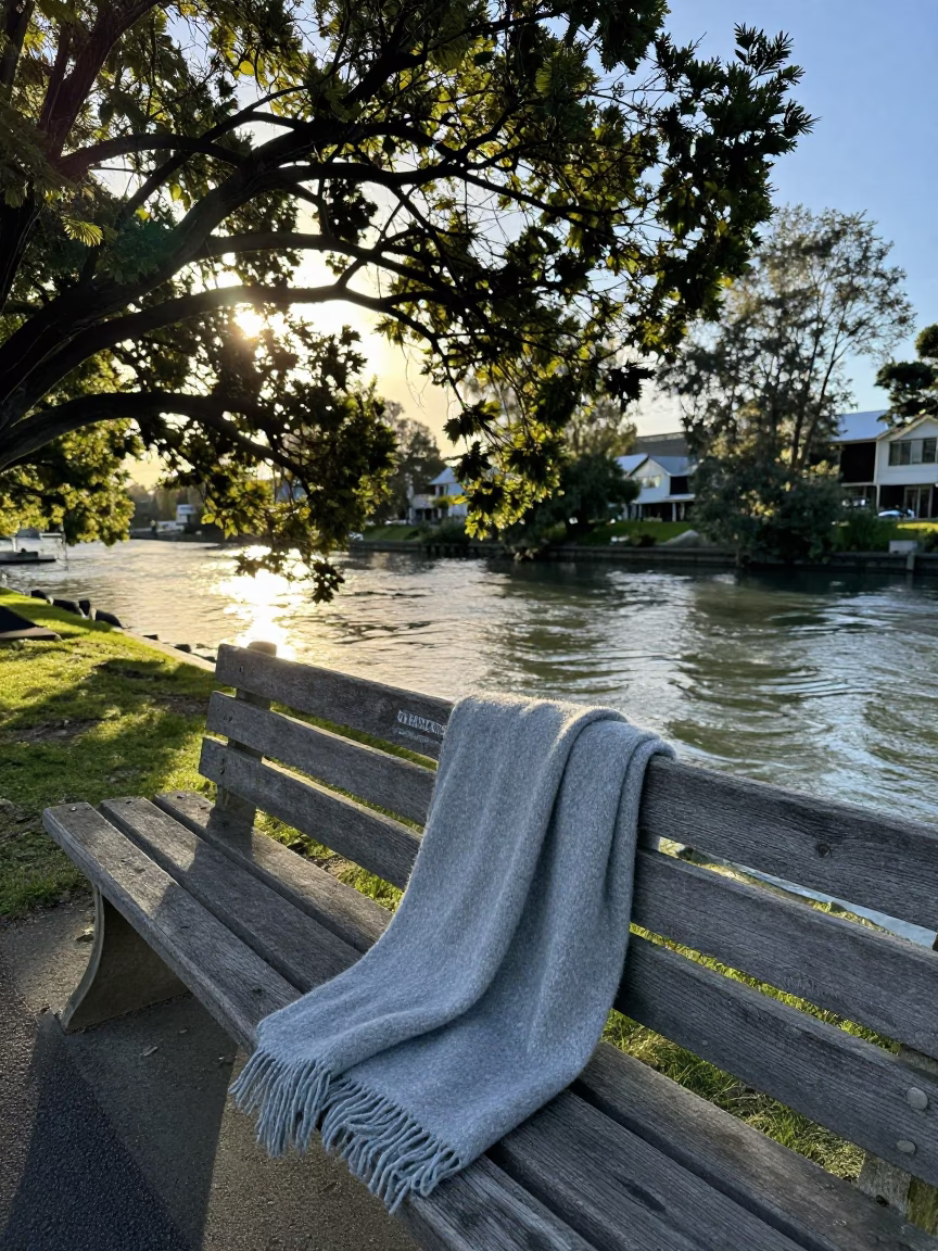Sunlit Wool Scarves on Bench Near Christchurch Avon River Early Afternoon in in Christchurch, New Zealand