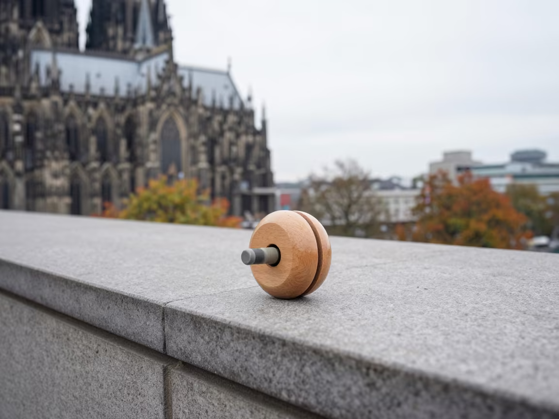 Sunlit Yo-Yo on Cologne Stone Ledge in on a stone ledge in Cologne