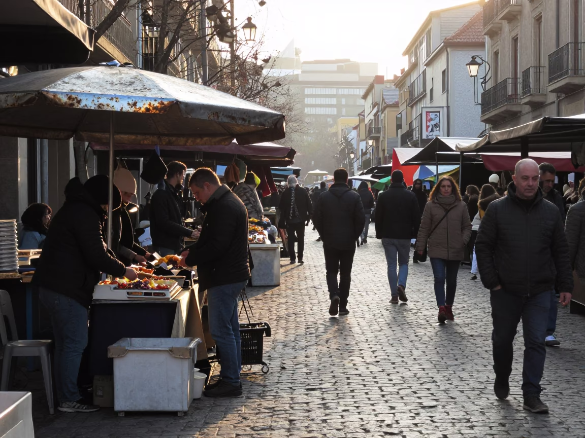 Sunrise in Bilbao captures busy street scene with dented metal rim in in Bilbao, Spain