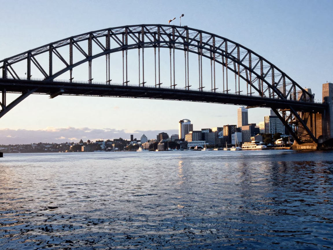 Sunrise Light on Auckland Harbour Bridge Steel and Water Reflections in in Auckland, New Zealand