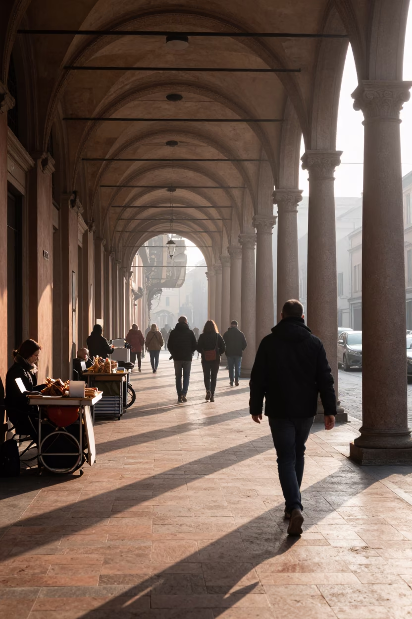 Sunrise Light on Bologna Porticoes with Morning Commuters and Street Vendors in in Bologna, Italy
