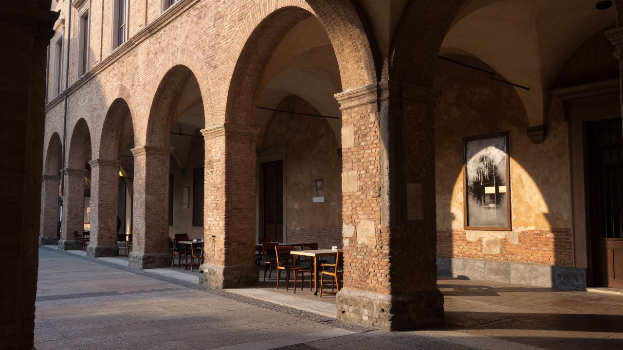 Sunrise light on historic Bologna arches with condensation on cafe glass in in Bologna, Italy