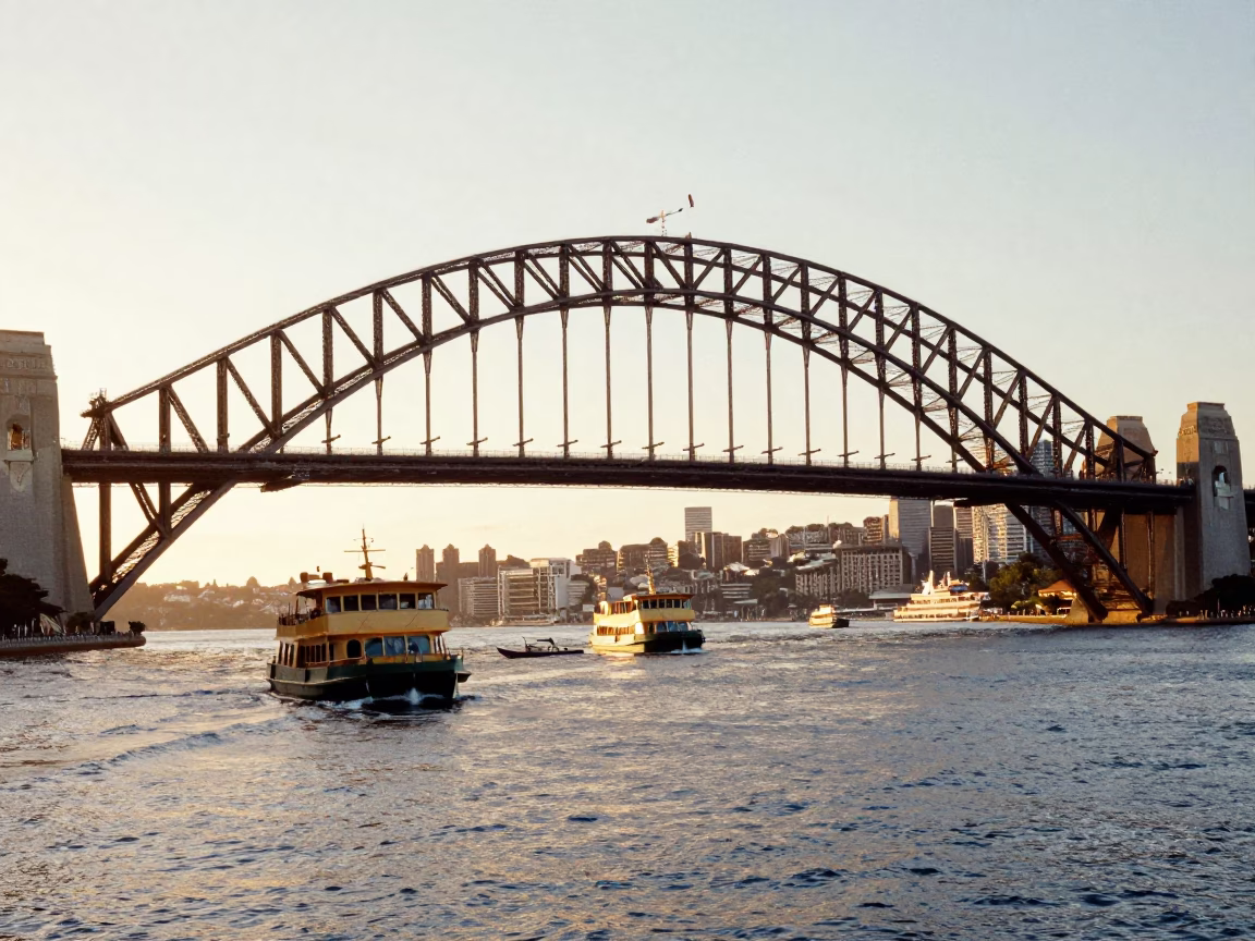 Sunrise light on Sydney Harbour Bridge and ferry traffic in New South Wales Australia in in Sydney, New South Wales, Australia
