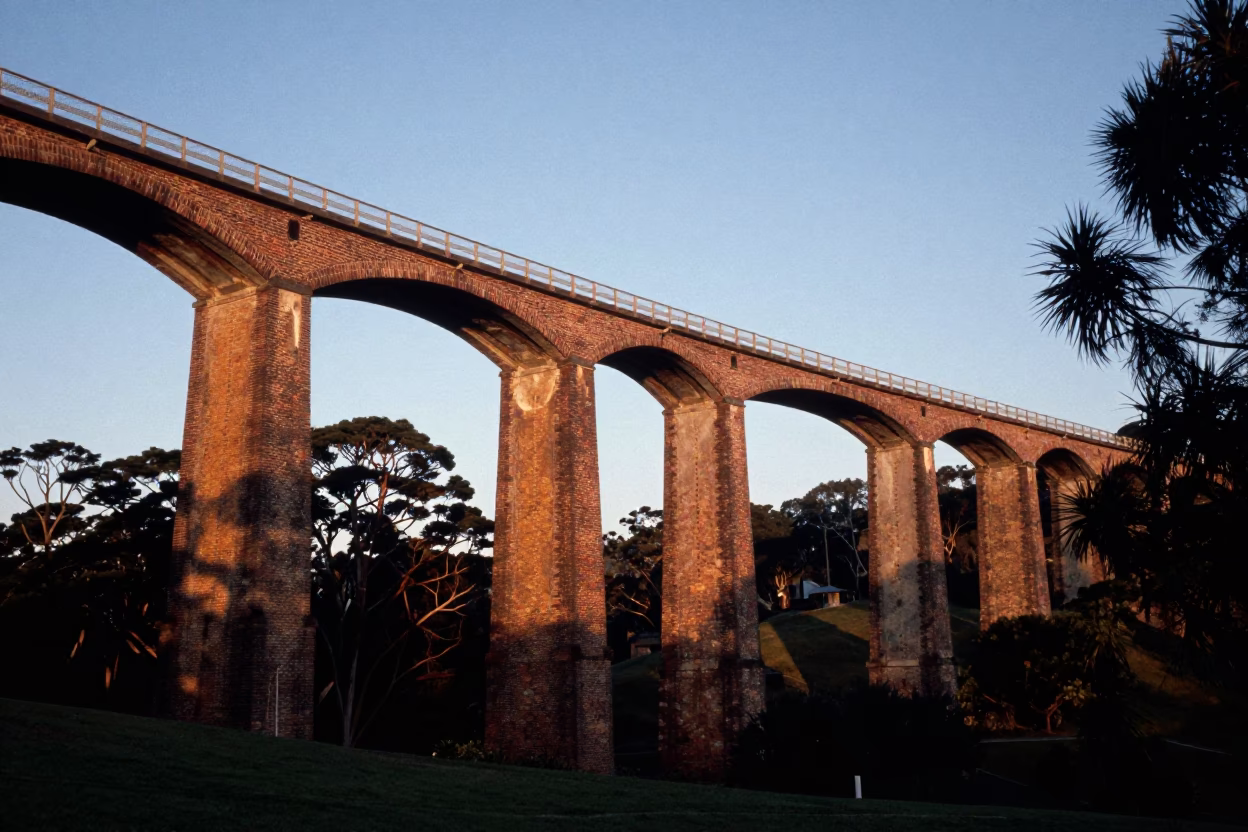 Sunrise Over Hobart Tasmania Viaduct Curving Through Cypress Trees and Brick Kilns in in Hobart, Tasmania, Australia