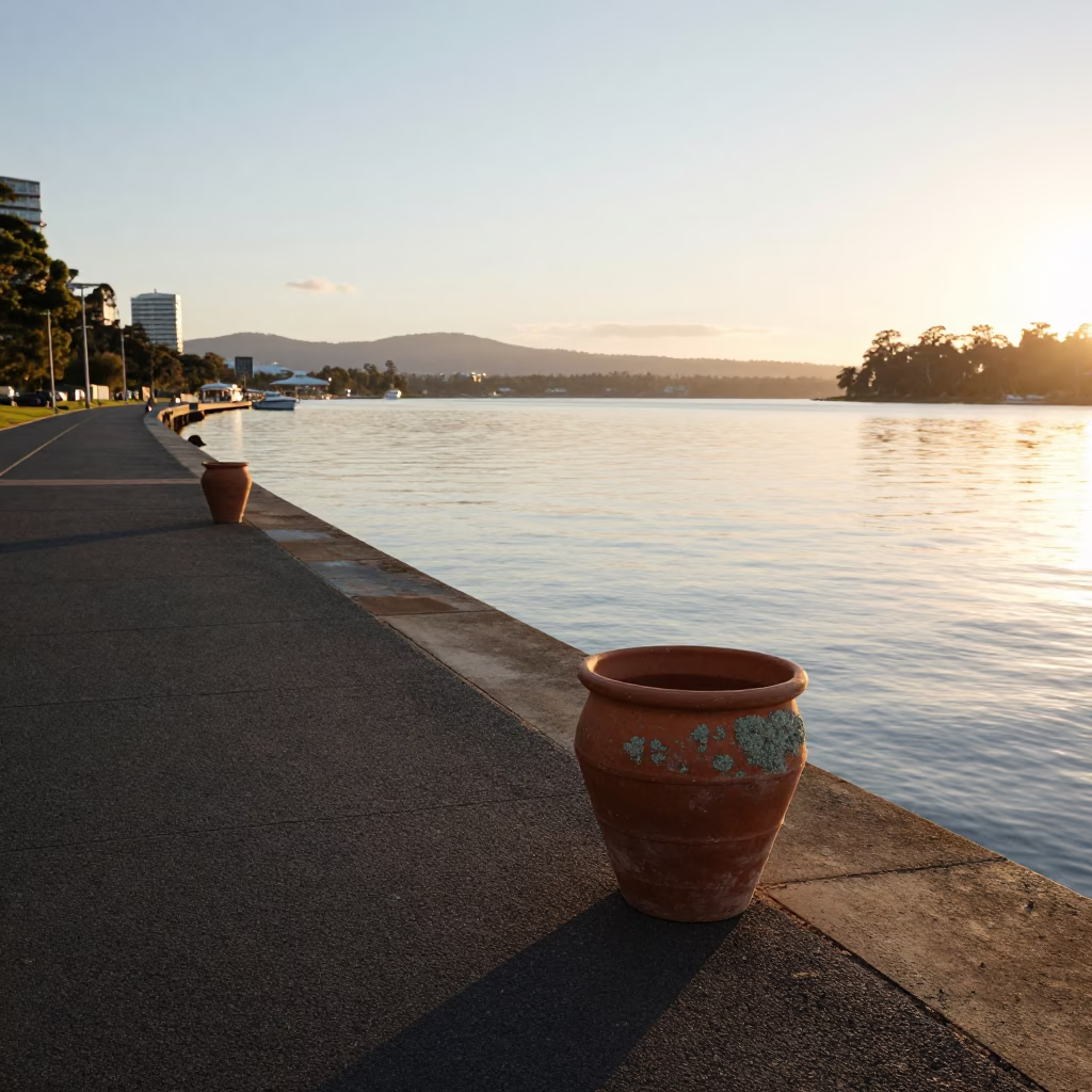 Sunrise over Hobart Tasmania waterfront with terracotta pots and lichen boulders in in Hobart, Tasmania, Australia