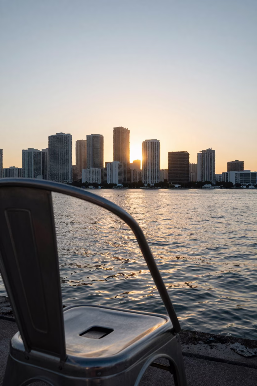 Sunrise over Miami Florida skyline with brushed steel chair rung and bridge maintenance cradle in in Miami, Florida, United States