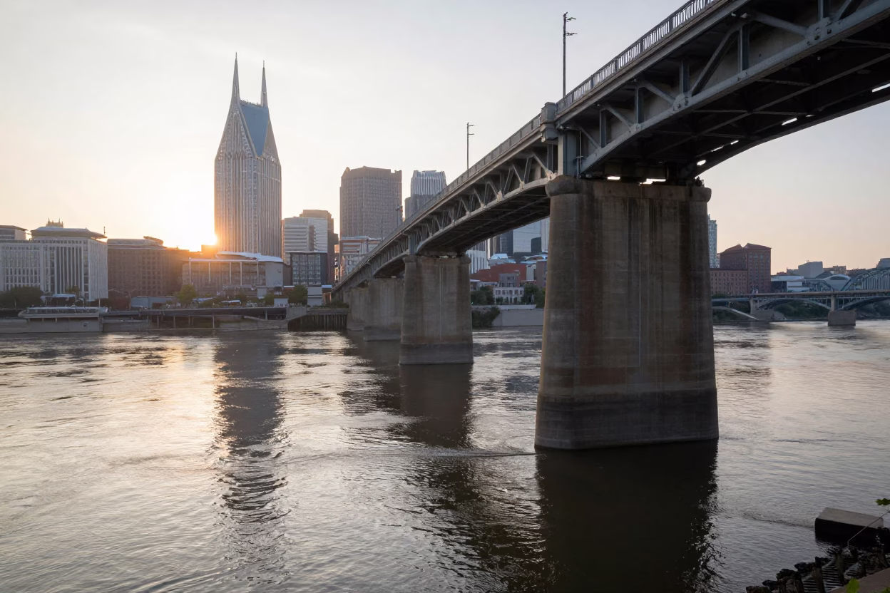 Sunrise Over Nashville Tennessee River Bridge Pier Cutwater and Flood Brown Current in in Nashville, Tennessee, United States