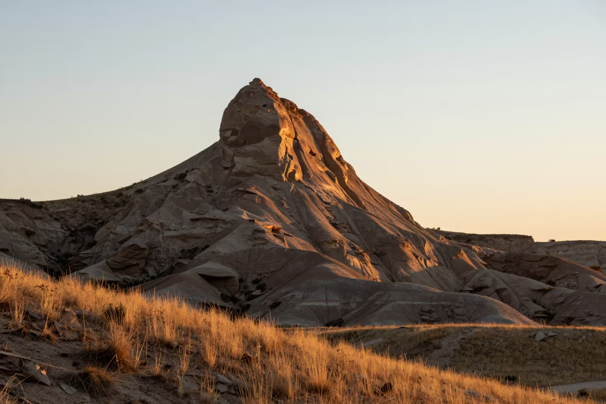 Sunrise Rim Light on Towering Butte Ridge View in from a ridge above layered foothills near Pokhara