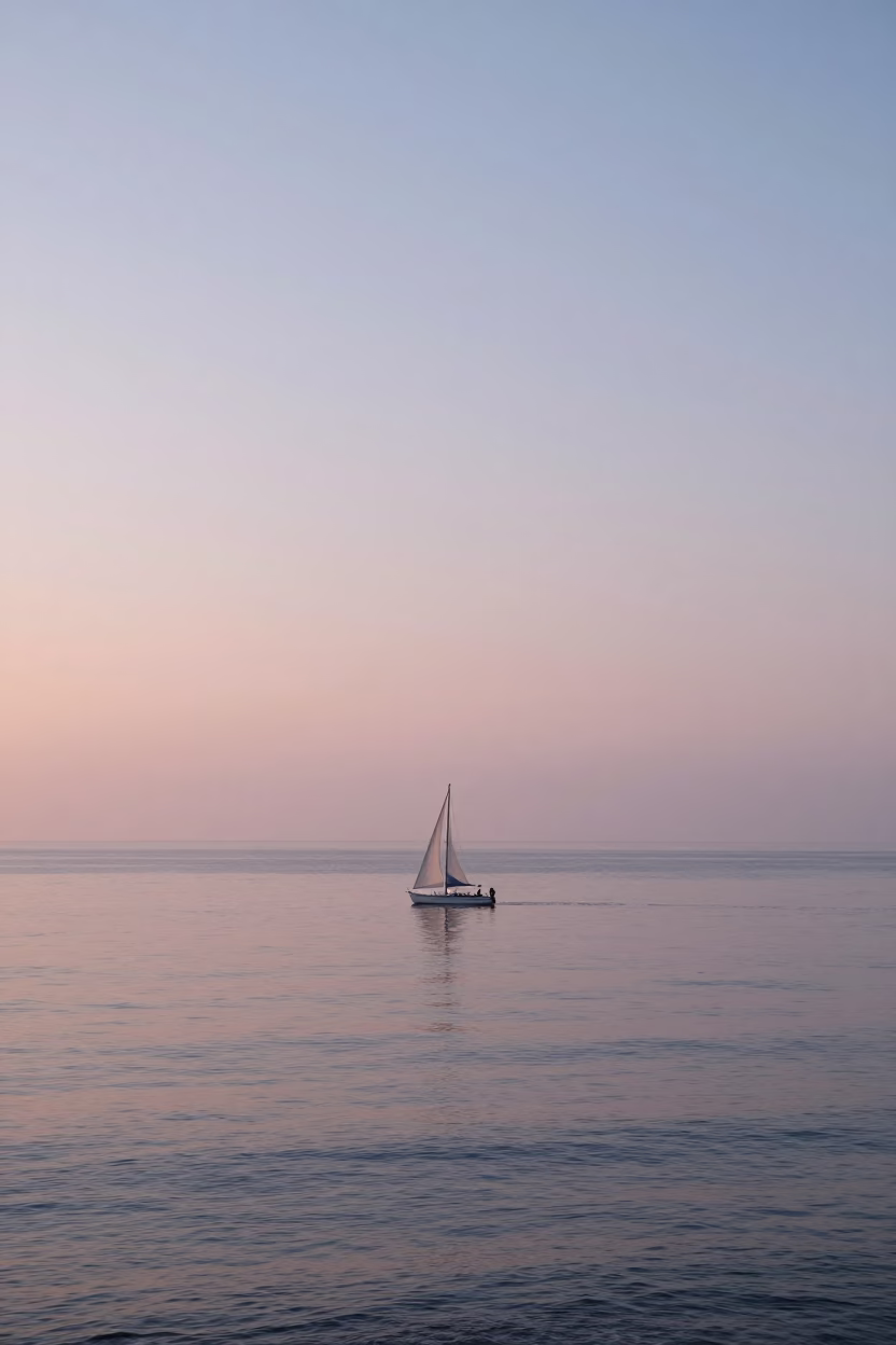 Sunrise View of Lima Peru Coastline with White Sailboat and Distant City Skyline in in Lima, Peru