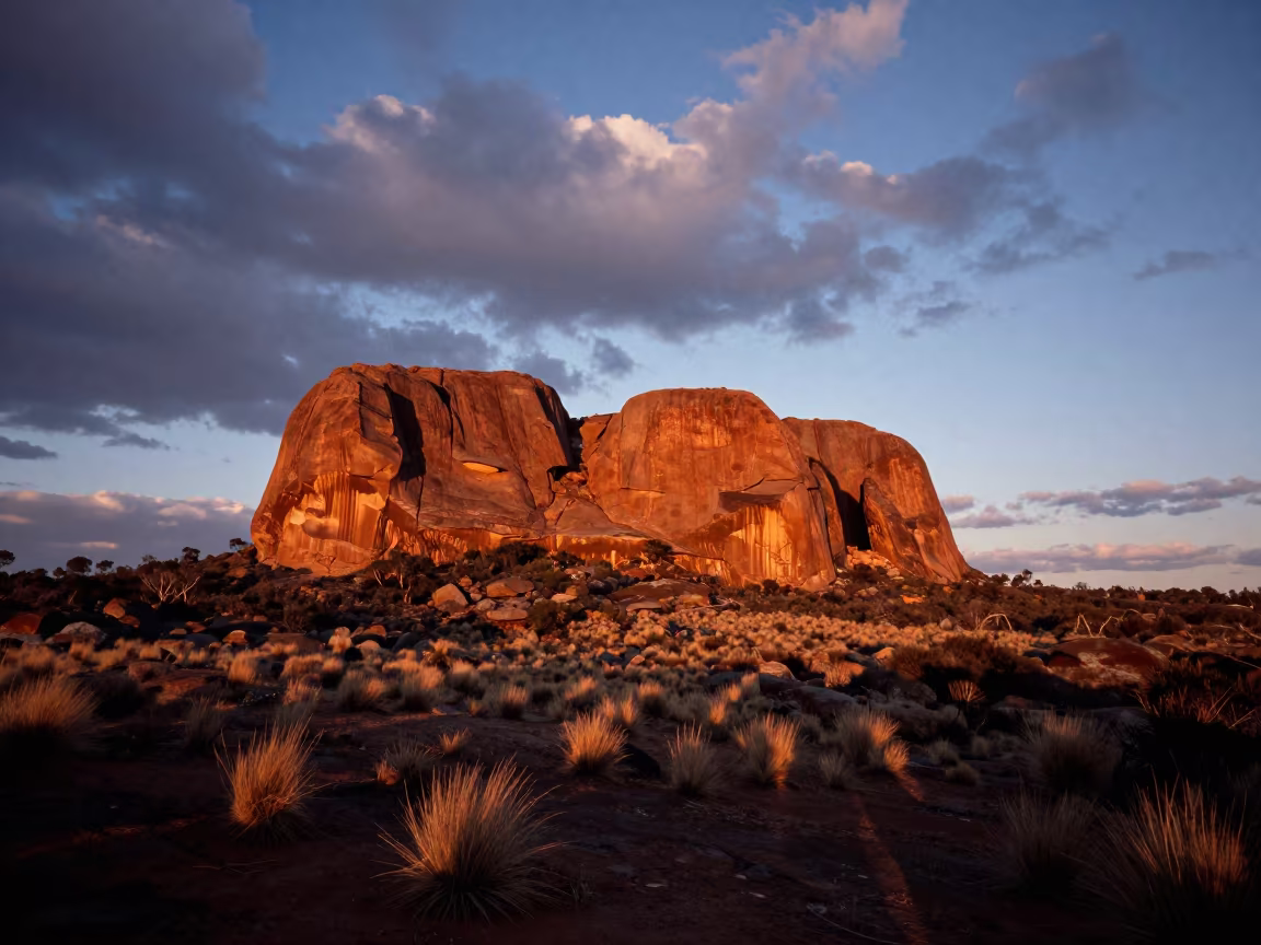 Sunset Over Aboriginal Sacred Rock Ridge Sydney in from a ridge above layered foothills near Sydney