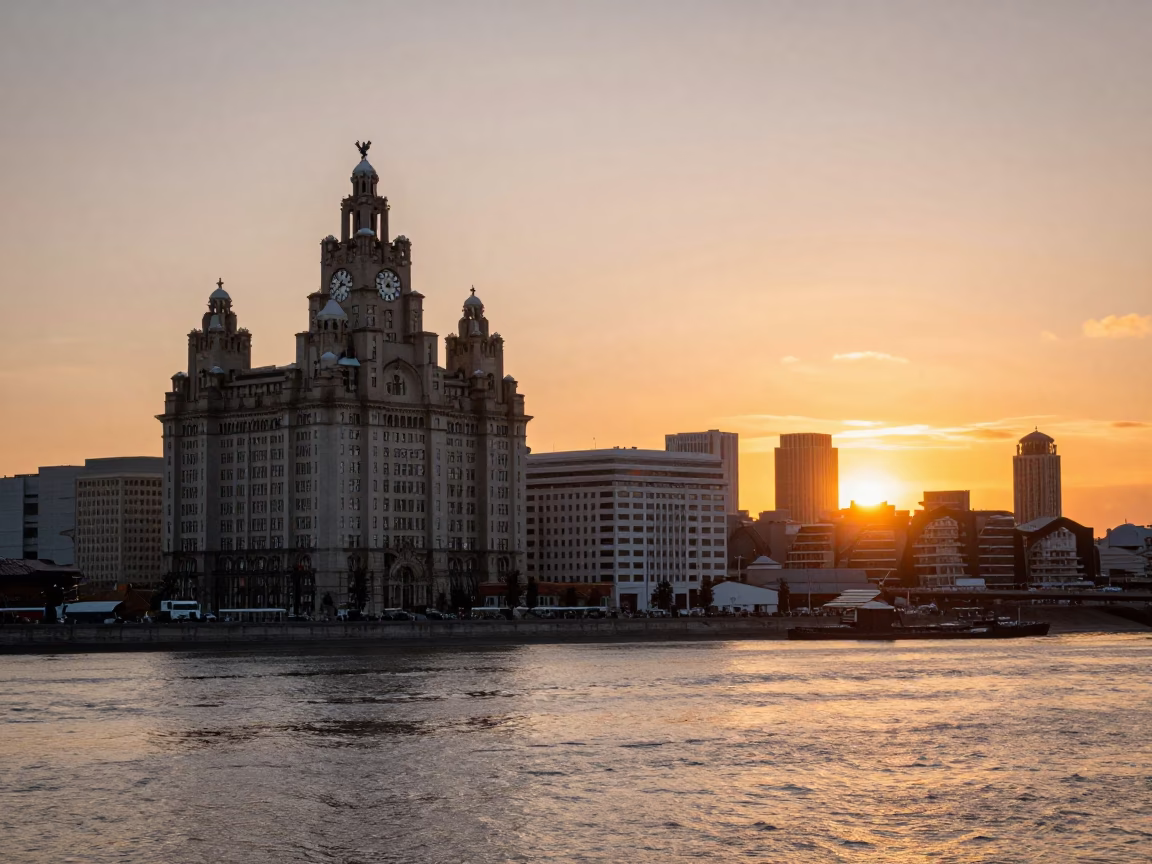 Sunset at Liverpool Pier Head with Royal Liver Building and Docks in in Liverpool, United Kingdom