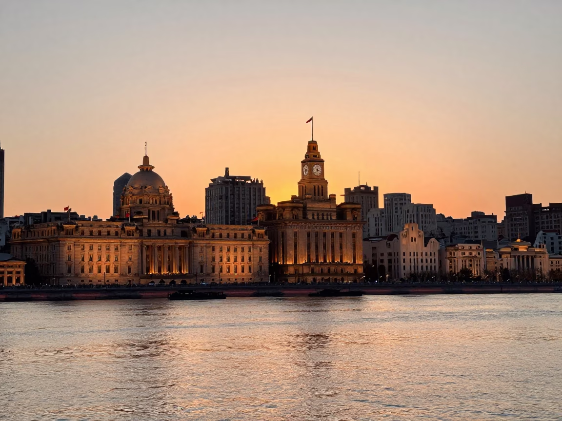 Sunset Horizon View of Shanghai Bund Promenade with Vintage Street Lamp and Pedestrians in in Shanghai, China