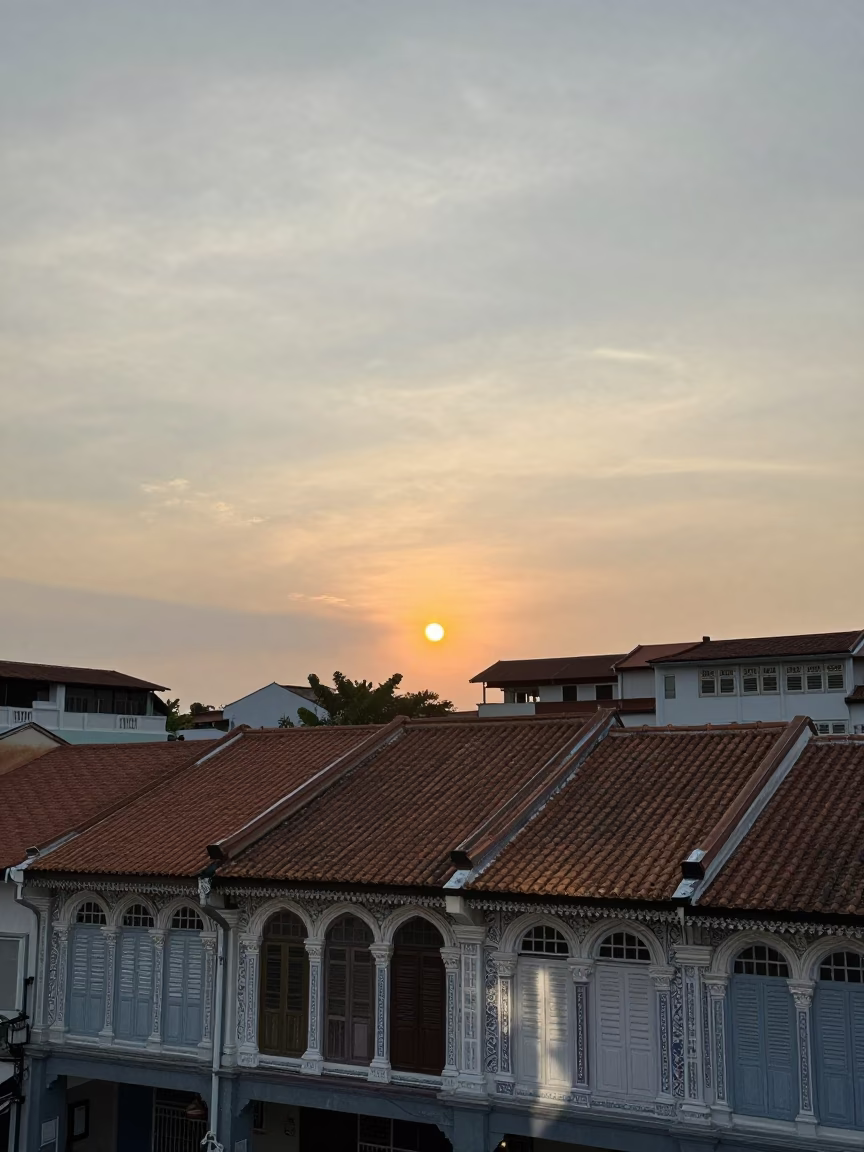 Sunset in George Town at As The Sun Drops Toward The Horizon in in George Town, Malaysia